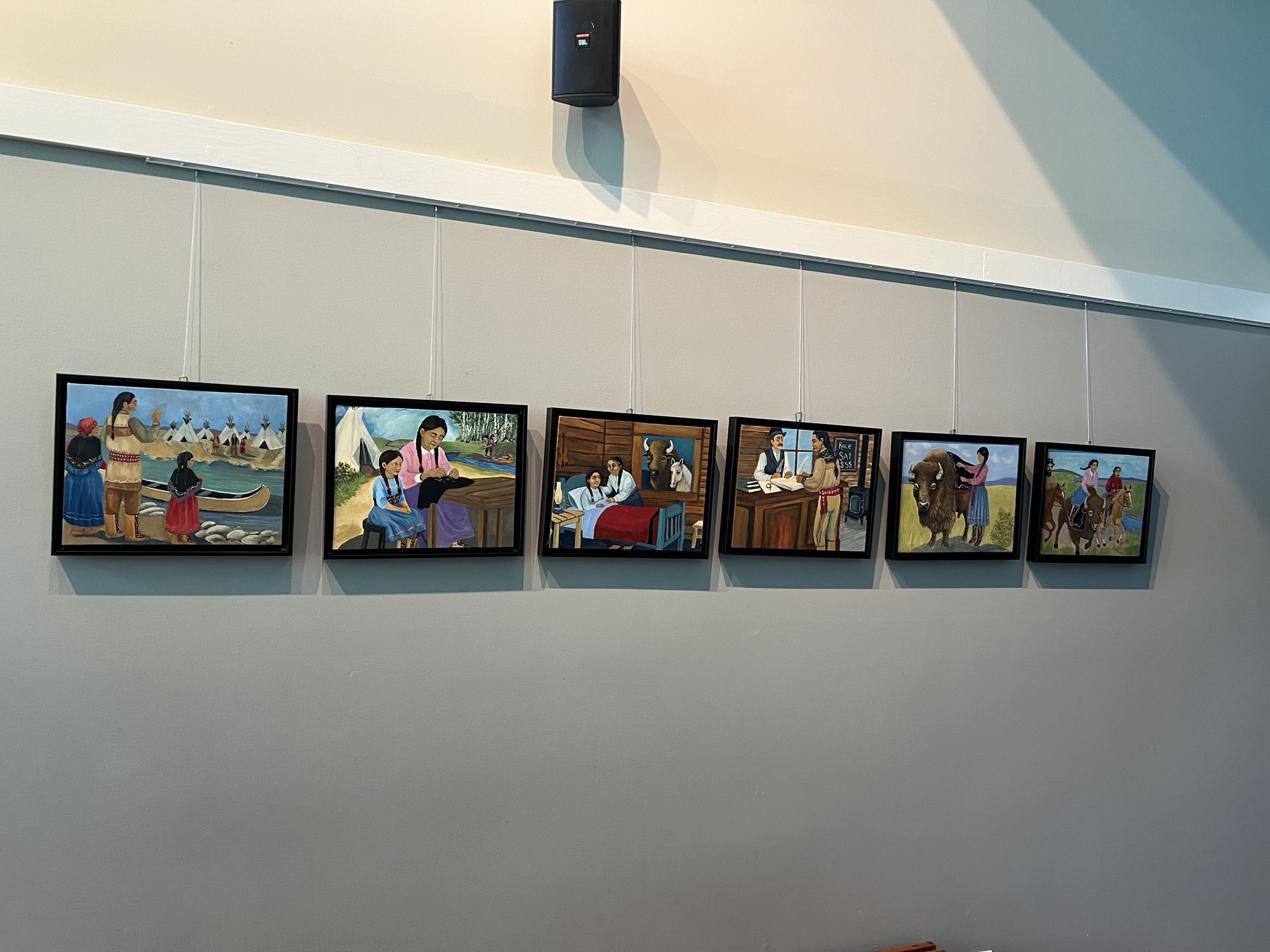 Installation view — paintings from Papaashi Bufloo by Sherry Leigh Williams on the wall at ArtSpring, Salt Spring Island